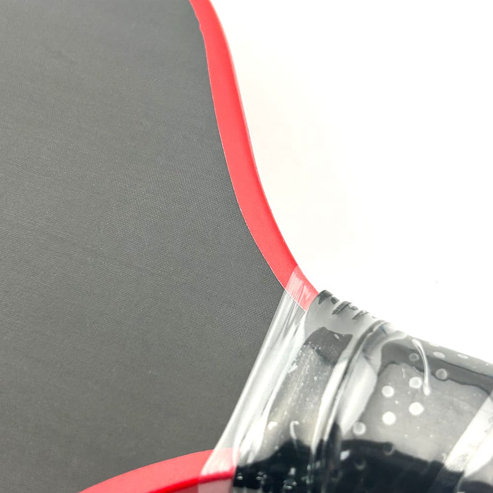 Close-up of paddle surface texture and edge construction