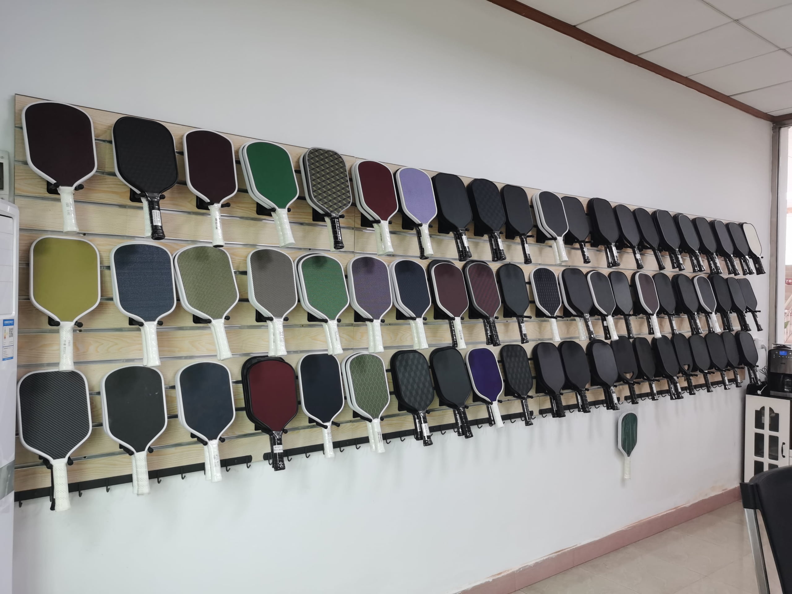 Finished custom pickleball paddle samples in the sample room
